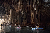 tourists with Kayak paddling through Tham Lot cave, Thailand, Southeast Asia
