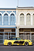 pimped sports car in front of colonial architecture, Phuket Town, Thailand, Southeast Asia
