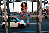 Graphic picture of young afro-american woman on a old steel bridge, Hackerbruecke, Munich, Bavaria, Germany
