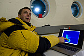 A scientist is watching a screen in the so-called bunker during an artificially triggered massive avalanche in the full-scale avalanche dynamics test site of the Swiss WSL Institute for Snow and Avalanche Research (SLF), Vallée de la Sionne, Western Berne