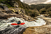 Spanish whitewater kayaking is paddling down a slide of the Rio Umia.