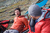 Team enjoys drier climates at base camp while they wait for better wheather conditions during a ski ascent of Mount Sanford Sheep Glacier Route in the Wrangell-St. Elias National Park outside of Glennallen, Alaska June 2011.  Mount Sanford at 16,237 feet 