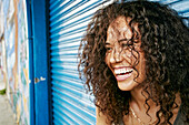 Mixed race woman laughing