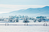 Irrigation system in snowy rural field