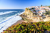Top view of the village of Azenhas do Mar with the ocean waves crashing on the cliffs, Sintra, Portugal, Europe