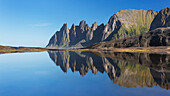 Okshornan rock peaks at the Ersfjordr in northern Norway with it's reflection in summer, Senja, Troms Fylke, Norway, Scandinavia