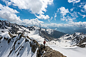 Terento, South Tyrol, Italy. Mountaineer along the ridge to Monte Gruppo  Hochgrubbachspitze.