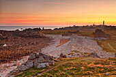 Ouessant island, Bretagne, France. A sunrise in the most westerly point of Ouessant island. In backgroud this is the Creac'h lighthouse