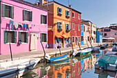 Classic view of the canal and colored houses in Burano. Venice, Veneto, Italy