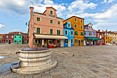 Europe, Italy, Veneto, Venice. Galuppi square in Burano island with the colorful houses