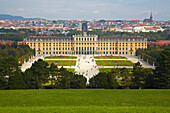 View from the park of Schönbrunn Castle at the castle and city of Vienna , River Danube , Austria , Europe