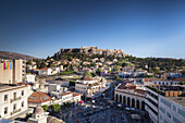 Greece, Central Greece Region, Athens, elevated view of Monastiraki Square and Acropolis, late afternoon.