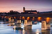 Germany, Baden-Wurttemburg, Black Forest, Bad Sackingen, the 400 year old wooden Rhein River bridge and Munster St. Fridolin, dusk.