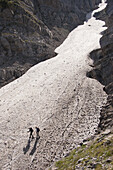 Mountaineers crossing a glacier on Olympus mountain. Macedonia, Greece.