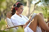Woman with digital tablet and headphones