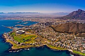 Aerial view of coastline of Cape Town with Signal Hill and Table Mountain in background, South Africa.