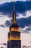 Empire State Building illuminated at twilight, New York, New York USA.