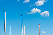 The masts of a modern sailing ship and flagpoles in the harbour, Kiel, Schleswig Holstein, Germany