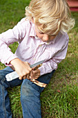 Boy carving wood