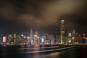 view at Central – Hongkong's financial district – at night, while ships are passing the harbour, Kowloon, Hongkong, China, Asia