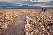 Path across Salt formations in Atacama Salt Flat,in background the Andes, Atacama Desert, Región de Antofagasta, Chile.