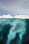 Above and below view of glacial ice near Wiencke Island, Neumayer Channel, Antarctica.