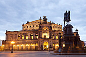 opera house Semperoper and Statue Of King Johann on Theater square in Dresden at night, Saxony, Germany, Europe.