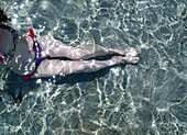 Enjoying swim in transparent sea, Menorca, Spain