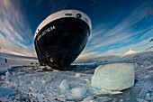 Marina Svetaeva, Ice-strengthened Russian cruise ship ( Aurora Expeditions) in McMurdo Sound - volcano Mt Erebus behind.