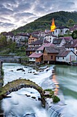 The weir and remains of a medieval bridge on the River Loue, Lods, Franche-Comté, France, Europe.