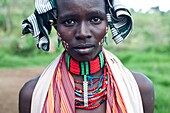 Young woman belonging to the Hamer tribe participating at a bull jumping ceremony. Omo valley in Ethiopia.