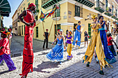 Street Entertainers Dancing On Stilts, Old Havana, Havana, Cuba.