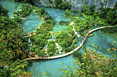 Tourists hiking in Plitvice Lakes National Park, Croatia.