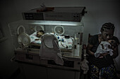 Young mother taking care of her premature babies, Sao Tome, Sao Tome and Principe, Africa