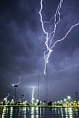 Lightning rises from tv towers in north Omaha.