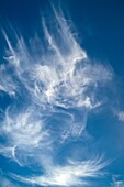 The play of wind with clouds in blue sky.