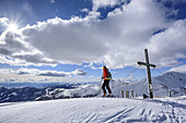 Woman back-country skiing standing at Steinnock, Steinnock, Nock Mountains, Biosphaerenpark Nockberge, Carinthia, Austria
