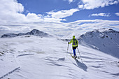 Woman back-country skiing ascending to Koenigstuhl, Koenigstuhl, Nock Mountains, Biosphaerenpark Nockberge, Carinthia, Austria