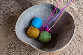 Knitting thread in a large calabash bowl in a Wayuu rancheria or rural settlement. Knitting, crocheting and weaving are fundamental to the social and economic lives of Wayuu women in La Guajira, Colombia.