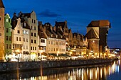 Evening at the riverfront on Motlawa river in Gdansk old town, pomorskie province, Poland.