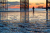 Winter evening on Brighton beach at low tide, East Sussex, England.