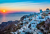 Iconic sunset in the town of Oia on the greek island Santorini (Thera). Santorini, classically Thera and officially Thira, is an island in the southern Aegean Sea, about 200 km (120 mi) southeast of Greece´s mainland. It is the largest island of a small, 