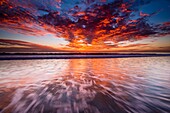 Sunset over the Channel Islands from Ventura State Beach, Ventura, California USA.