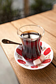 Traditional Turkish tea cup on the table in Grand Bazaar, Sultanahmet, Istanbul, Turkey,.