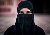 A woman visiting the mosque in the Taj Mahal.