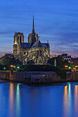 The medieval Notre Dame Cathedral on the Ile de la Cite in early evening light and River Seine, Paris, France, Europe