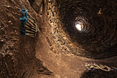'A round opening with sunlight viewed from an underground tunnel; Harran, Turkey'