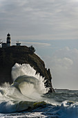 'Surf breaks at Cape Disappointment Lighthouse; Ilwaco, Washington, United States of America'
