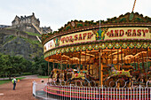 'Carousel in Princes Street Gardens with a view of Edinburgh Castle; Edinburgh, Scotland'