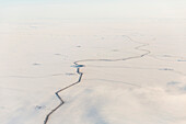 Aerial view of roads and other oil infrastructure on the Arctic tundra, Arctic Alaska, USA, Winter